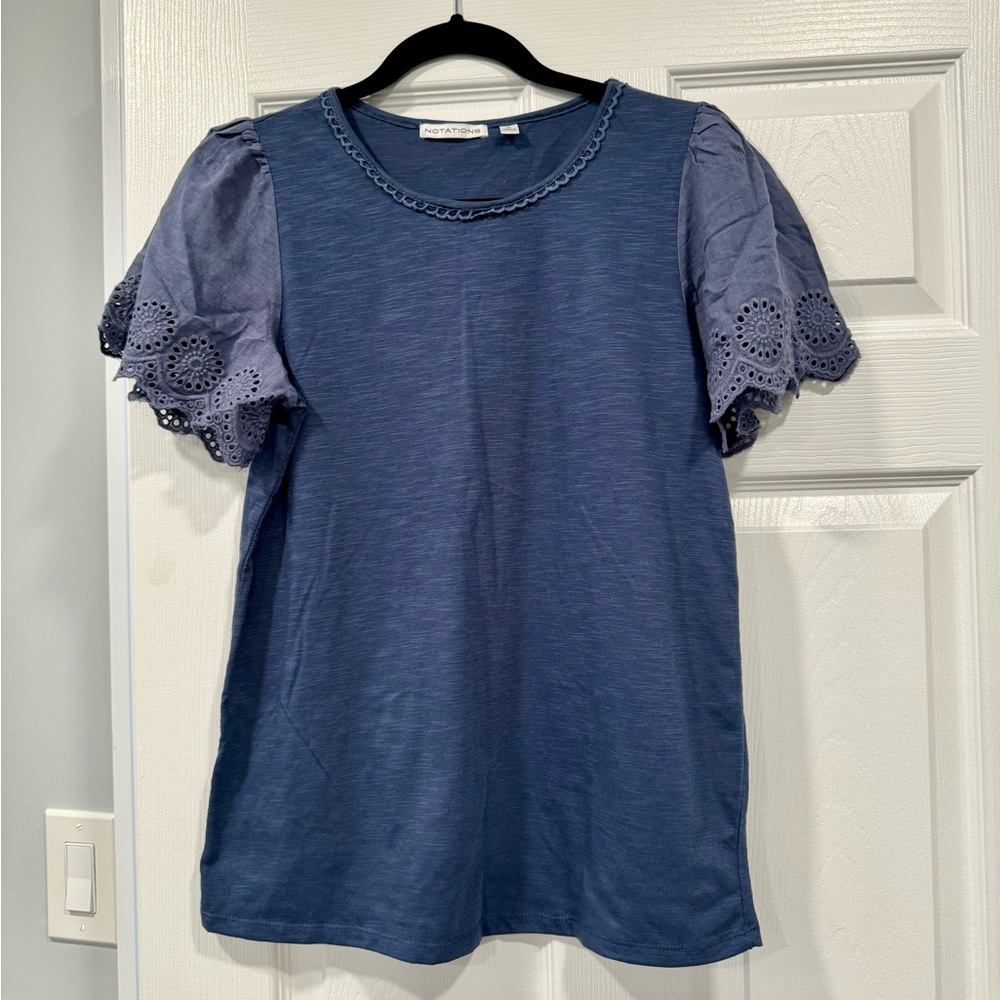 Women’s Short Sleeve with pretty detailed sleeves. Size M Brand New with Tags!